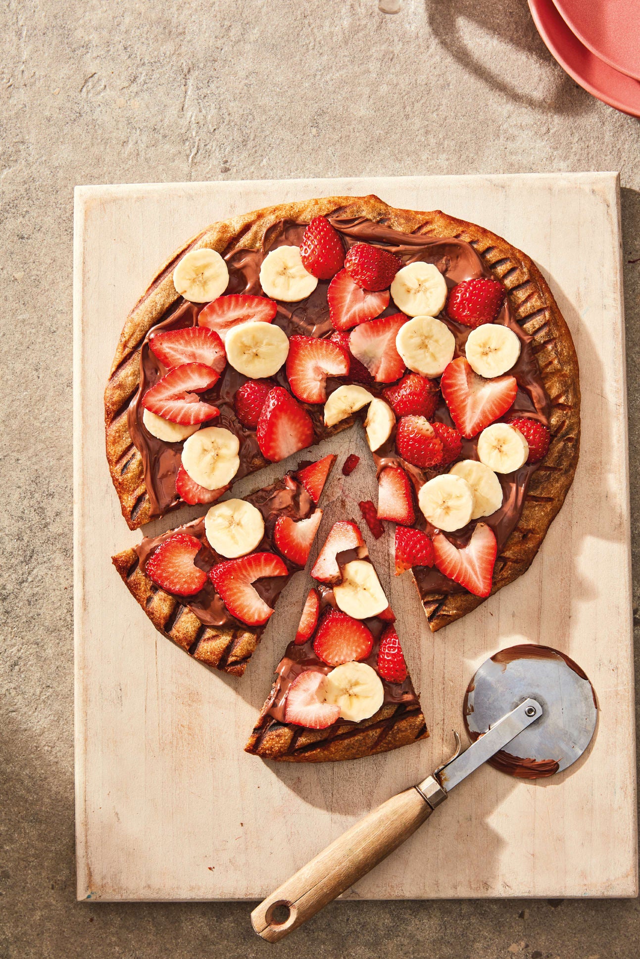 Photo de Pizza sucrée de choco à tartiner, fraises et banane prise par WW